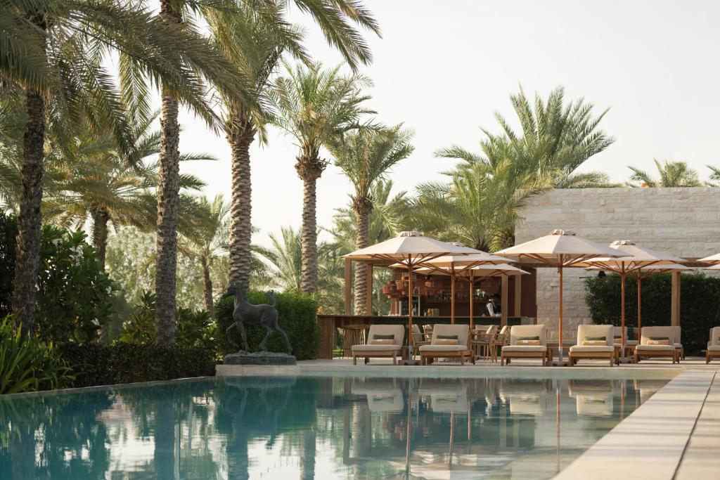 Luxury resort pool with palm trees